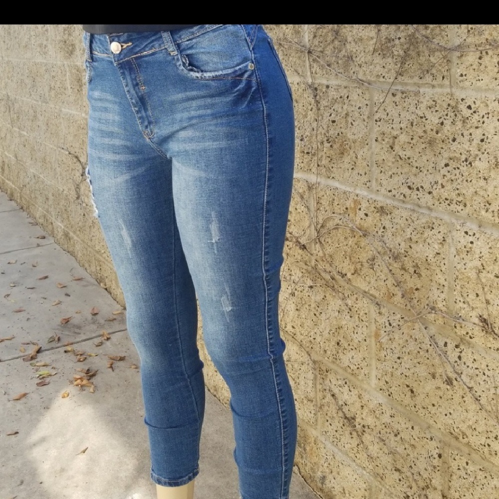 Distressed high rise jeans